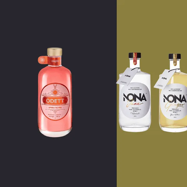 Apéritif sans alcool Sélection des marques belges Quatre bouteilles de gin sur fond coloré.