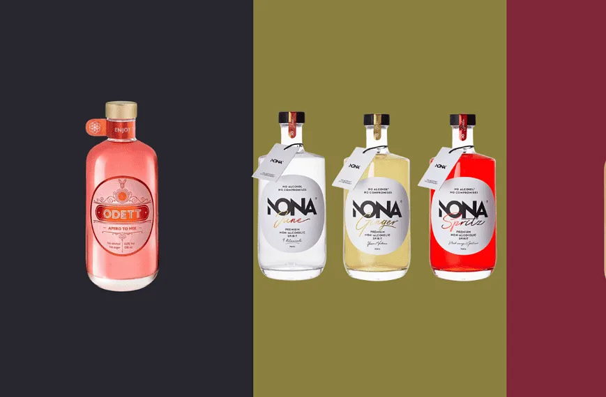 Apéritif sans alcool Sélection des marques belges Quatre bouteilles de gin sur fond coloré.